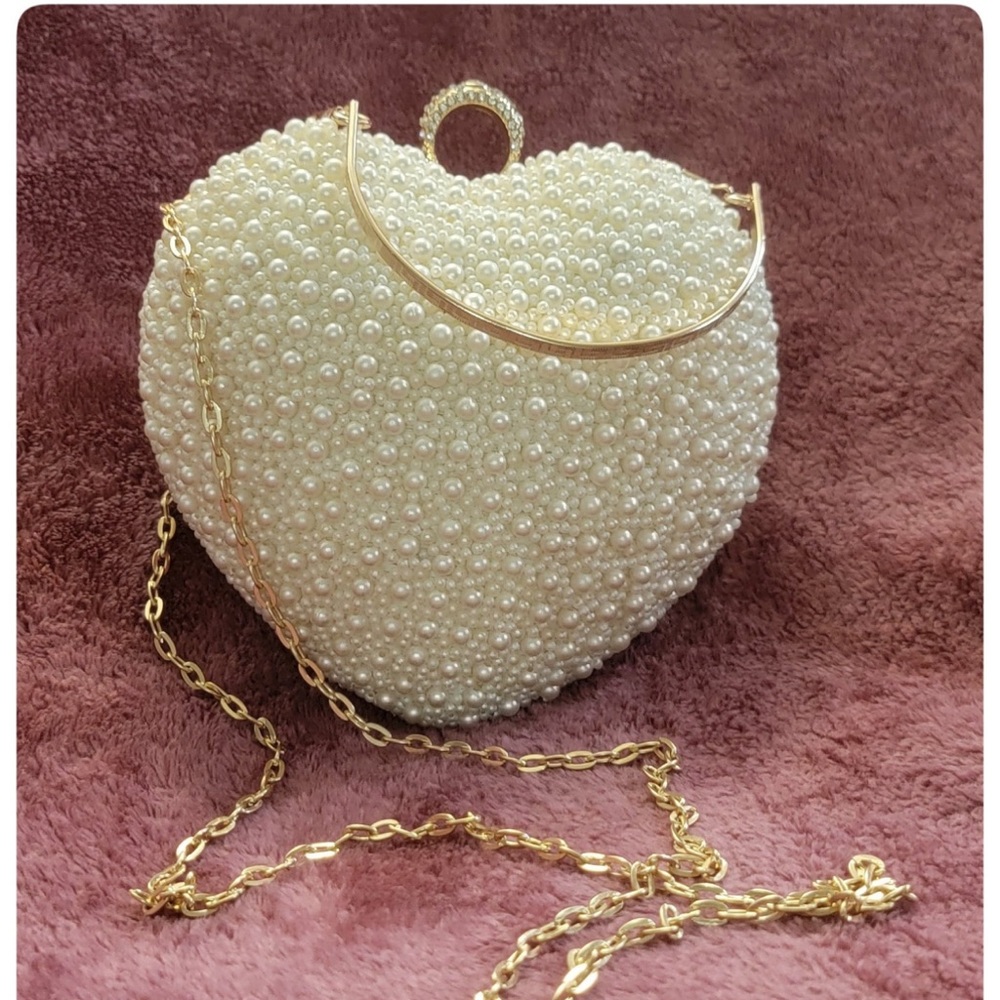 Handmade white pearl heart shaped clutch/purse.